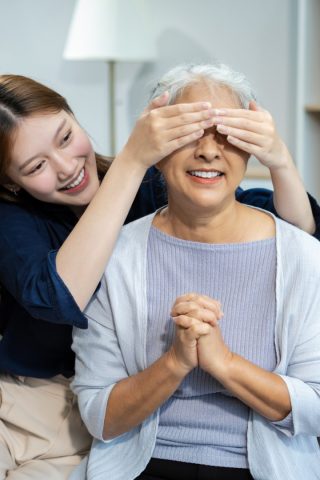 An elderly person using VisionXI on a smartphone for safe and independent living.